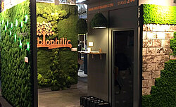 Freund moss wall with tree motif and wood biophilic lettering prepared by MIAT, Surface Design Show London, exhibition stand